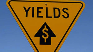 yellow-upside-down-triangle-sign-saying-yields-with-arrow-pointing-up-and-dollar-sign