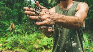 hand-dusting-off-dirt